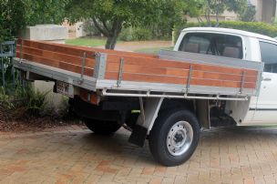 Three rows of 69 x 15mm Finger Jointed Merbau Screening from Bunnings separated by 7mm gaps.